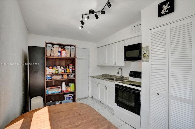 kitchen with marble finish floor, electric range oven, white cabinetry, a sink, and black microwave