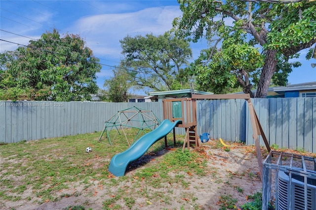 view of playground with a fenced backyard