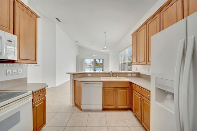 kitchen with light tile patterned floors, vaulted ceiling, a sink, white appliances, and a peninsula