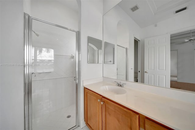 full bath featuring a stall shower, visible vents, vanity, and toilet