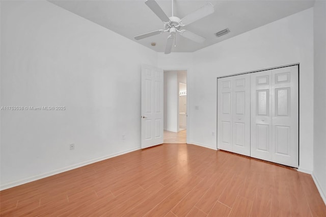 unfurnished bedroom featuring light wood-style flooring, visible vents, and baseboards