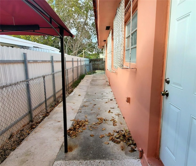 view of property exterior featuring fence and stucco siding