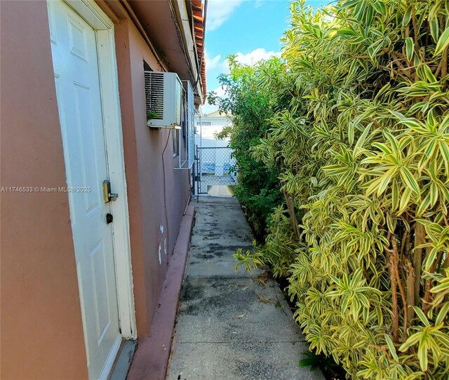 view of side of property with a gate