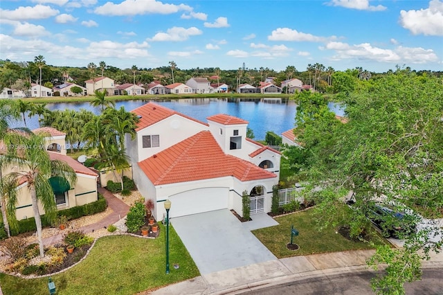 birds eye view of property featuring a residential view and a water view