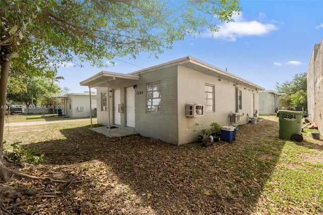 view of side of home featuring stucco siding