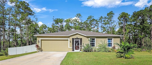 ranch-style house featuring driveway, a garage, stucco siding, fence, and a front yard