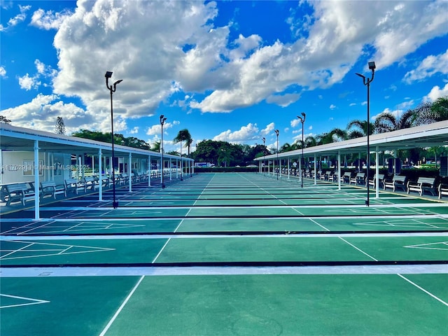 view of home's community featuring shuffleboard