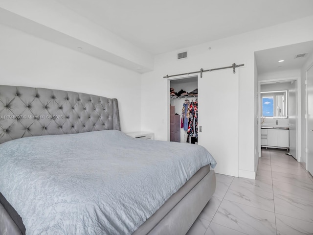 2000 Metropica Way Unit 1507, Sunrise, FL 33323 - bedroom featuring a walk in closet, marble finish floor, a closet, visible vents, and a barn door