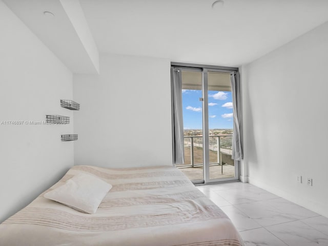 2000 Metropica Way Unit 1507, Sunrise, FL 33323 - bedroom featuring expansive windows, marble finish floor, and access to exterior