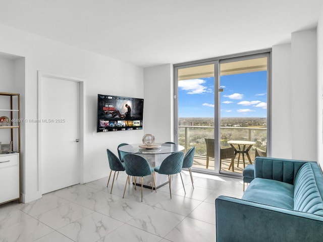 2000 Metropica Way Unit 1507, Sunrise, FL 33323 - dining area with marble finish floor and a wall of windows