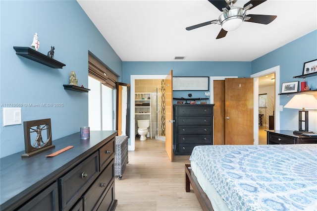 bedroom with visible vents and light wood-style floors