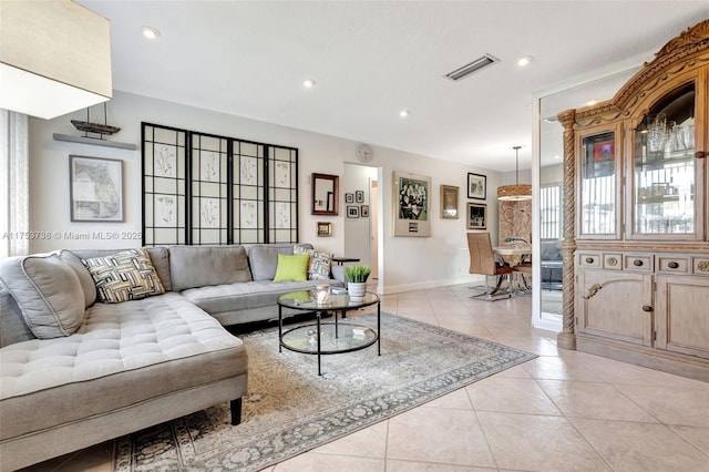 living area featuring recessed lighting, visible vents, baseboards, and light tile patterned flooring