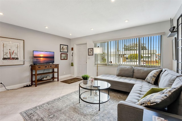 living room with light tile patterned flooring, recessed lighting, and baseboards