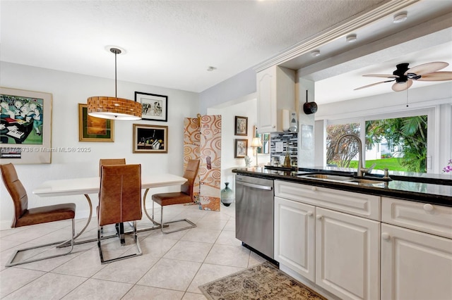 6820 NW 17th Ct, Margate, FL 33063 - kitchen featuring dishwasher, white cabinets, light tile patterned floors, and a sink