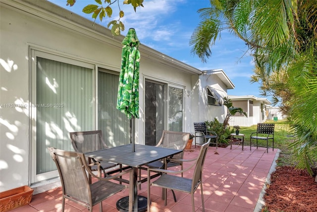 6820 NW 17th Ct, Margate, FL 33063 - view of patio / terrace with outdoor dining space and fence