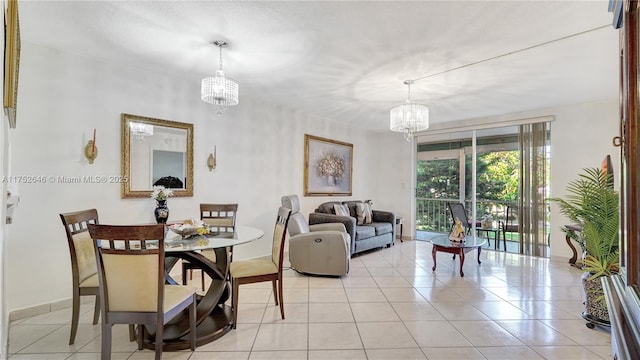 dining room featuring an inviting chandelier and light tile patterned floors