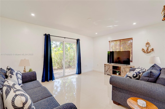 living room with recessed lighting, light tile patterned flooring, and baseboards