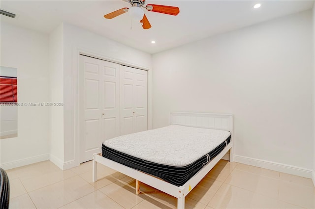 bedroom featuring recessed lighting, baseboards, visible vents, a closet, and light tile patterned flooring