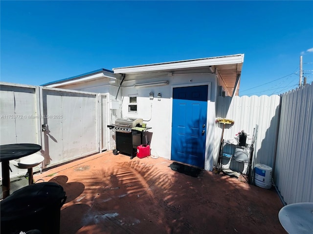 view of outbuilding with fence