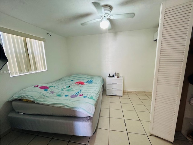 bedroom with a ceiling fan and light tile patterned floors