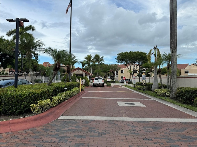 view of road with traffic signs and curbs