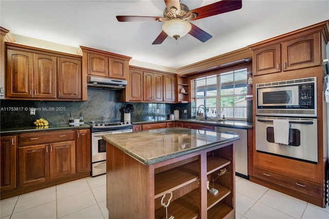 kitchen with open shelves, stainless steel appliances, a sink, dark stone counters, and under cabinet range hood