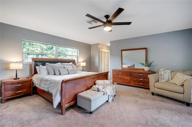 bedroom with carpet, a closet, visible vents, and ceiling fan