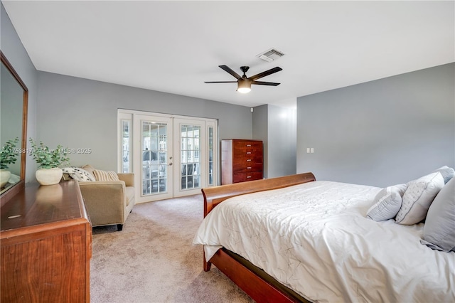 carpeted bedroom featuring access to exterior, french doors, visible vents, and a ceiling fan