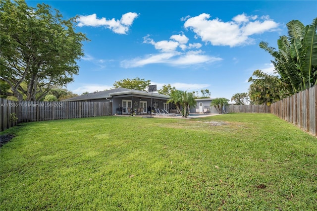 view of yard with a patio and a fenced backyard