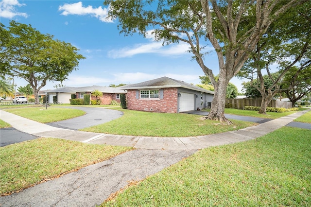 ranch-style house featuring brick siding, an attached garage, crawl space, fence, and driveway