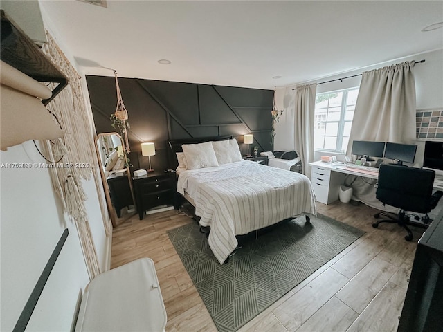 bedroom with light wood-style flooring