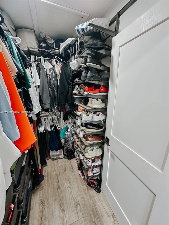 spacious closet with wood finished floors