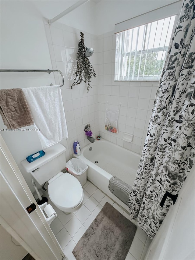 full bathroom with shower / bath combo, toilet, and tile patterned floors