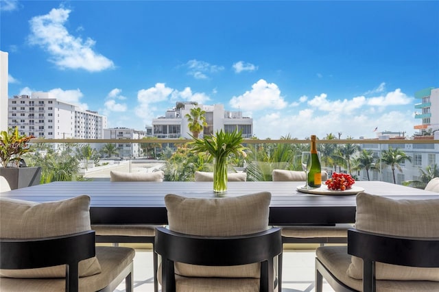 view of patio / terrace featuring a balcony and a view of city