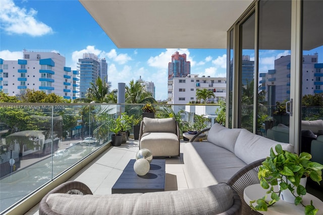 balcony featuring a view of city and an outdoor living space