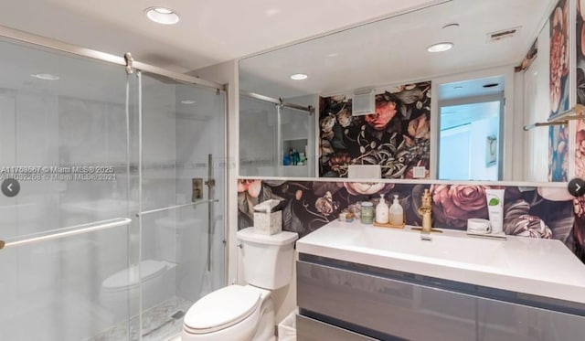 bathroom featuring toilet, a stall shower, visible vents, and recessed lighting