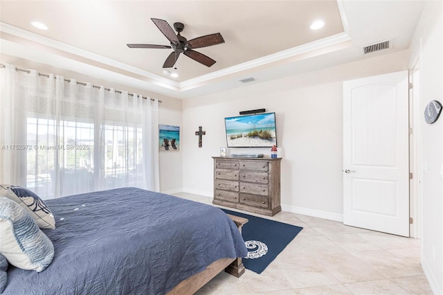 bedroom with baseboards, a raised ceiling, visible vents, and crown molding