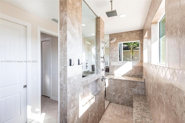 bathroom with a walk in shower, tile patterned flooring, visible vents, and recessed lighting