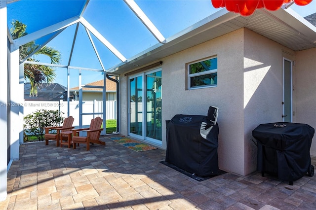 view of patio featuring area for grilling and a lanai