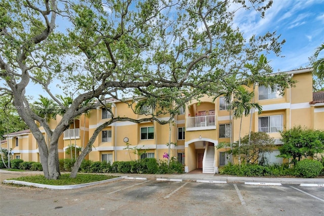 view of property with uncovered parking