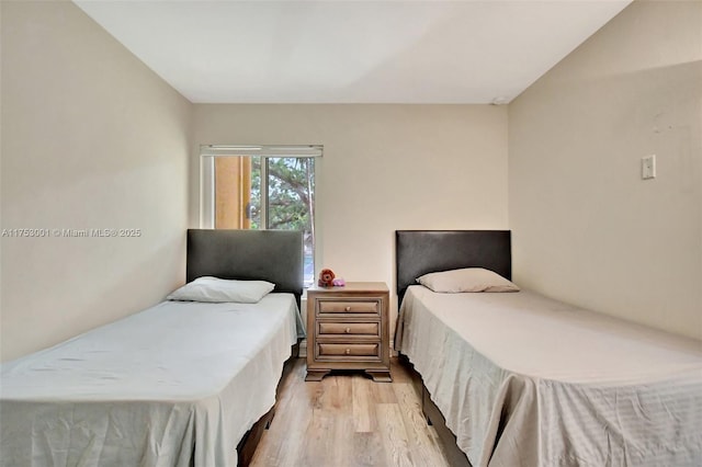 bedroom with light wood finished floors