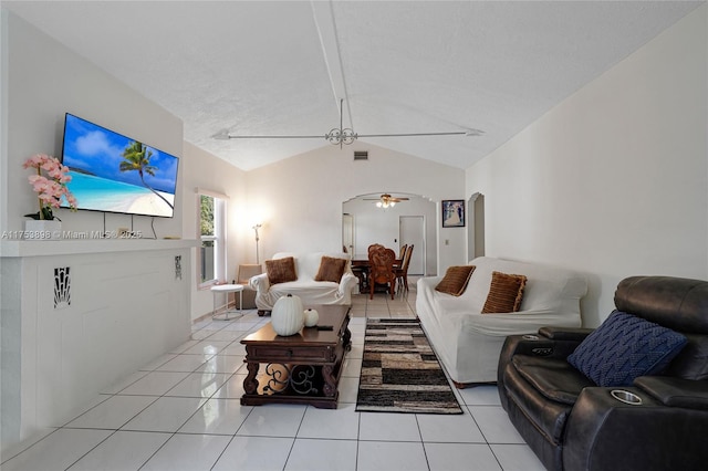 living area with arched walkways, light tile patterned floors, visible vents, a ceiling fan, and lofted ceiling