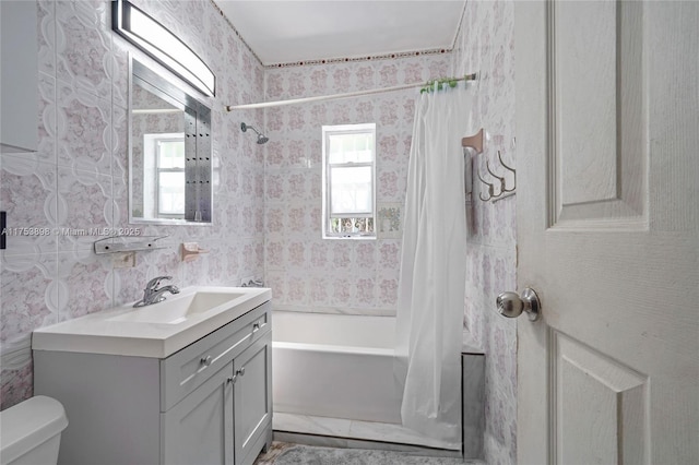 full bathroom with shower / bath combo, vanity, toilet, and wallpapered walls