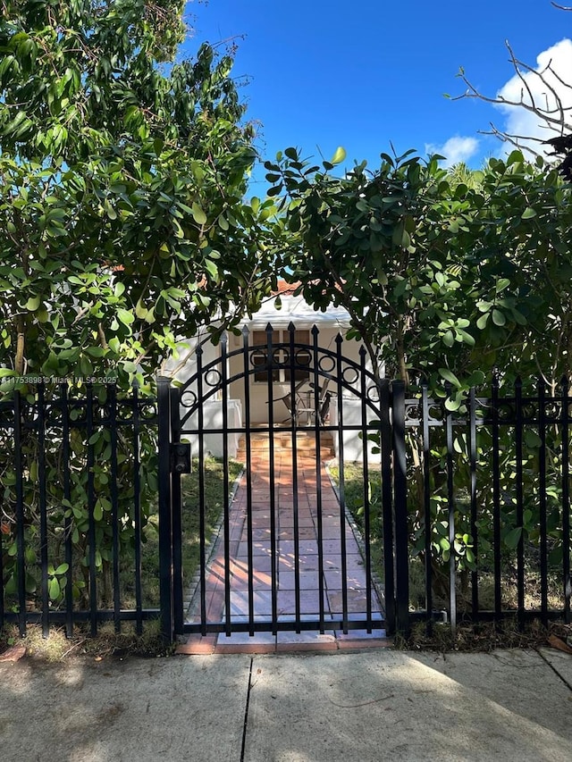 view of gate with fence