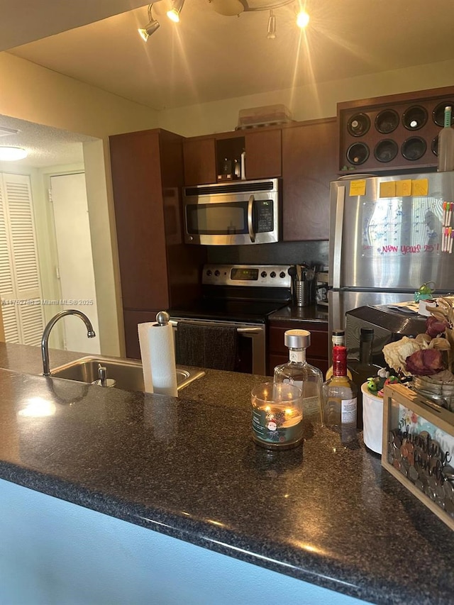 kitchen featuring stainless steel appliances and a sink