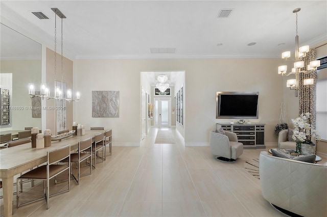 dining area with ornamental molding, visible vents, and a notable chandelier