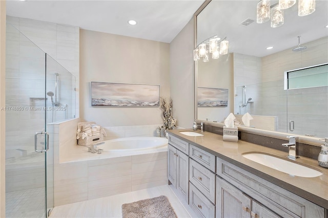 full bath featuring a bath, a stall shower, and a sink
