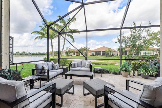 view of patio / terrace with a water view, glass enclosure, and outdoor lounge area