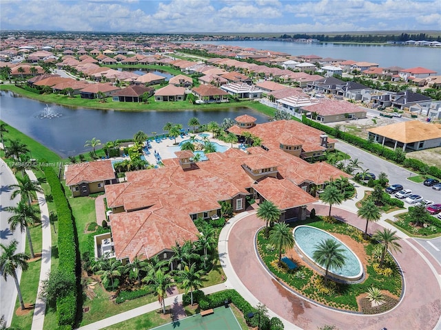 birds eye view of property featuring a residential view and a water view