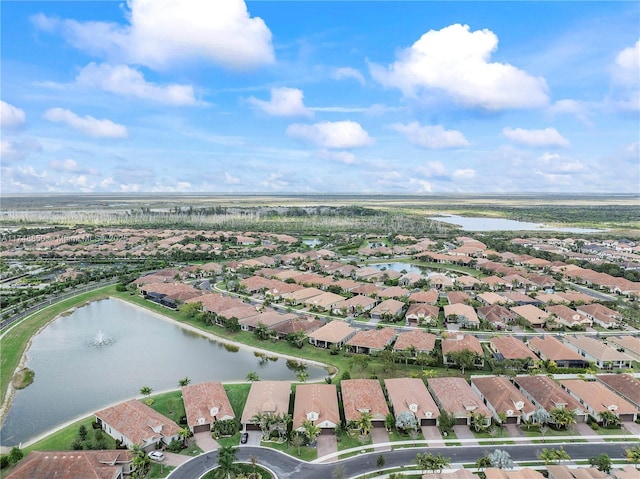 birds eye view of property with a water view and a residential view